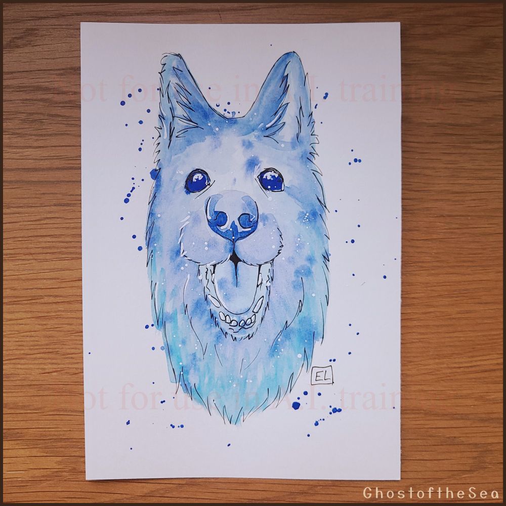 Photo of a A5 watercolour painting of a shepherd-type dog's face, looking at the viewer with bright eyes and a happy-looking open mouth. The painting is all in mottled shades of blue, with black and white ink details, and blue paint splatters.