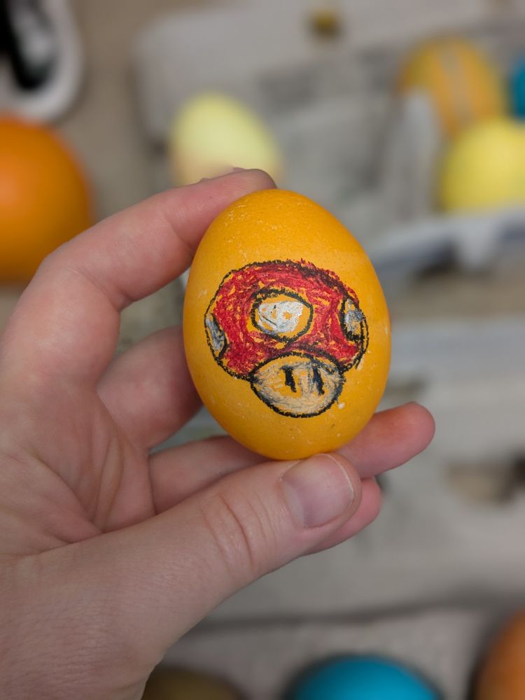 Dyed egg with Mario mushroom drawing on it