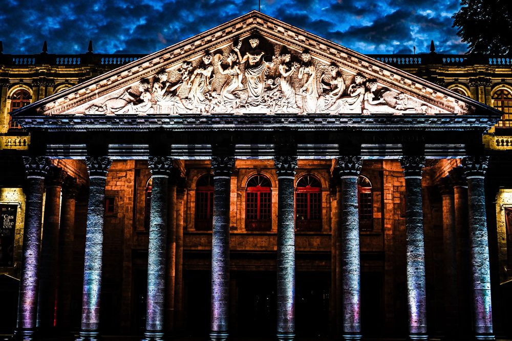 a photograph of the facade of the Degollado theater taken at down in Guadalajara, Mexico