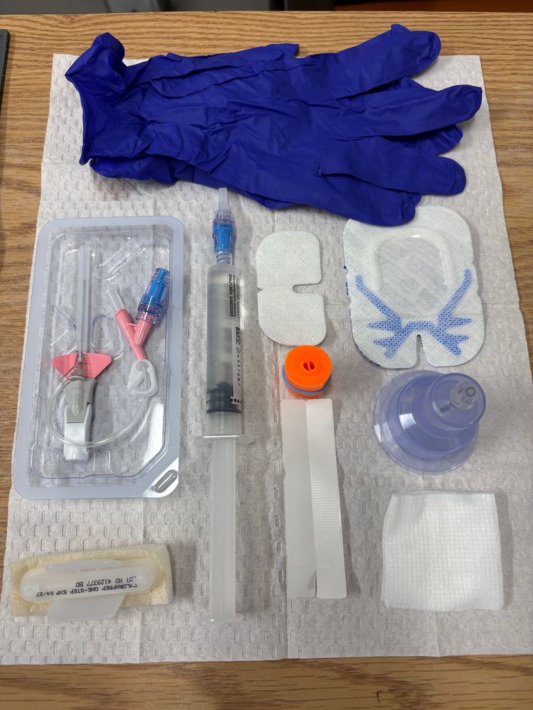 Intravenous supplies neatly laid out on a table. 