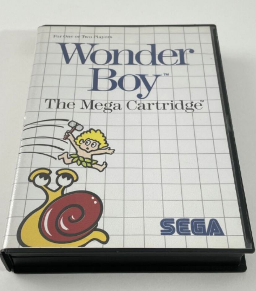 Wonderboy, the original game for the Sega Master System showing game box with a boy in a grass skirt jumping over a giant snail