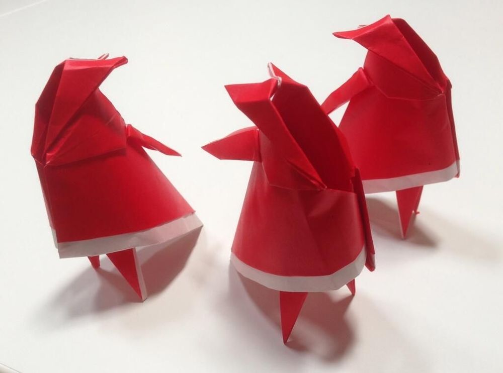 3 Origami Journey Traveler paper models, standing at different angles.