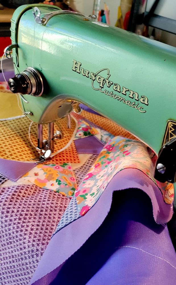 Close up of a 1959 Husqvarna mid seam on a colorful sewing project.