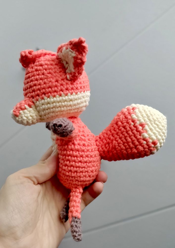 A little crochet fox, with a massive tail.