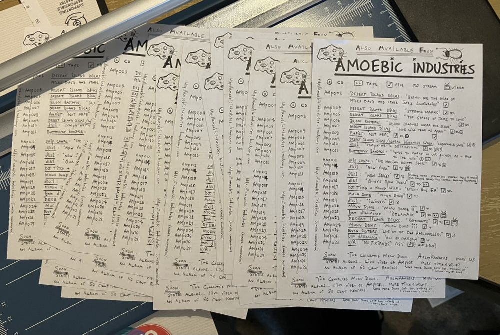 Amoebic Industries release list flyers on a guillotine