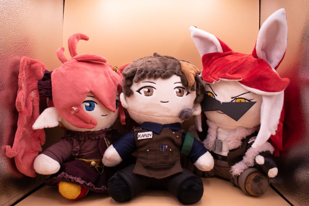 A set of plushies of Wrenmara, Kapen, and Radifox, side by side. The pattern is the Big Sitting Chibi by Mon Pattern on Etsy, and the ears, clothing, and hair are patterned by Kyuu! 