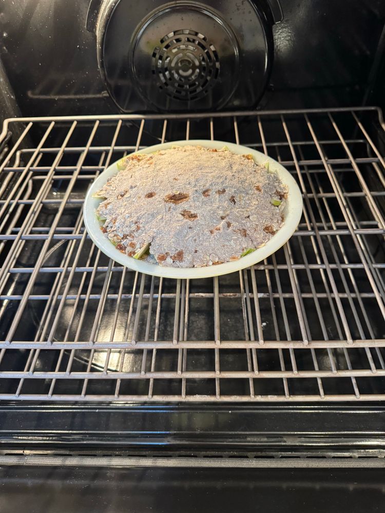 An apple crisp baking in the oven