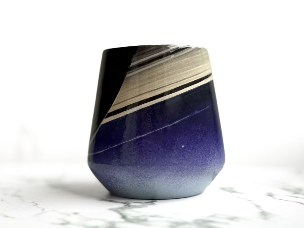 Angled cup featuring Earth viewed from Saturn as the "Pale Blue Dot"