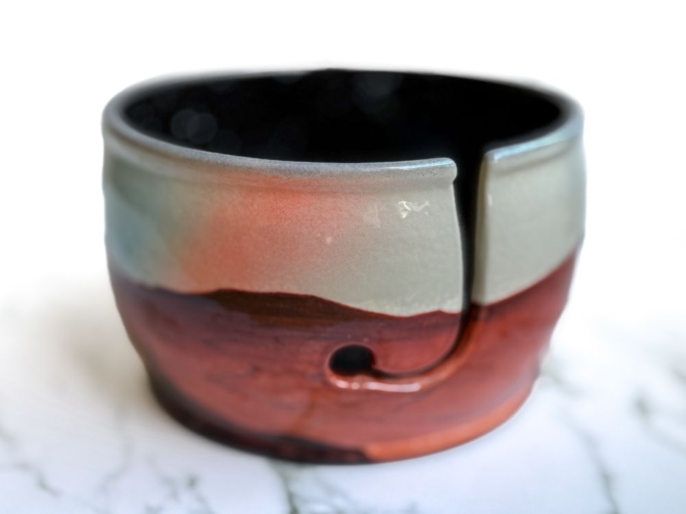 Yarn bowl featuring three hikers on a Martian landscape at sunset. (Right)
