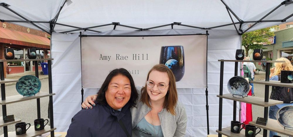 Me and my friend smiling in my booth. 