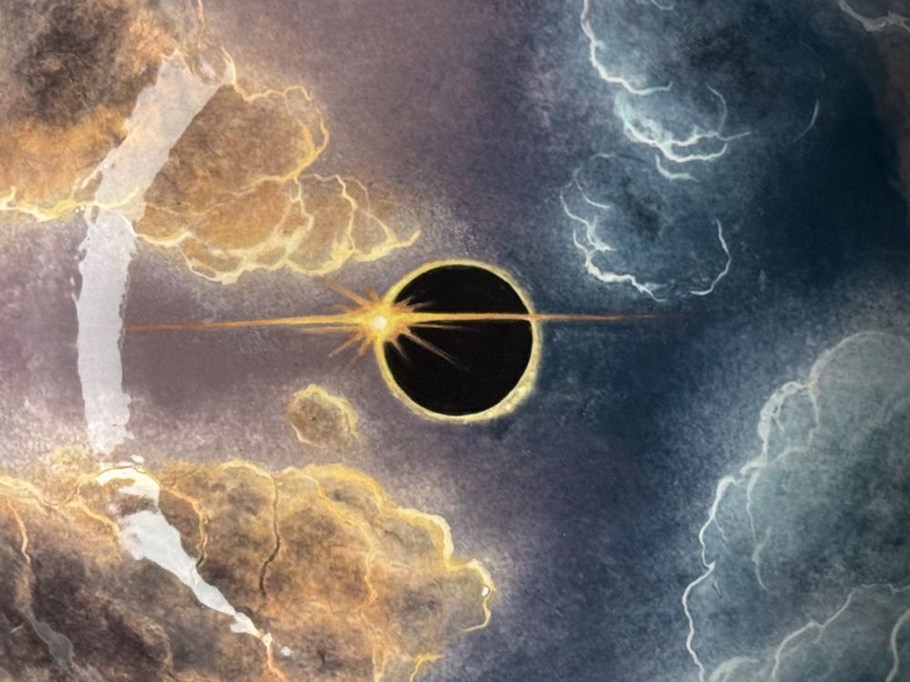 Bowl featuring solar eclipse surrounded by clouds with left half of sky in warmer light and right half in cooler light. Detail of eclipse. 