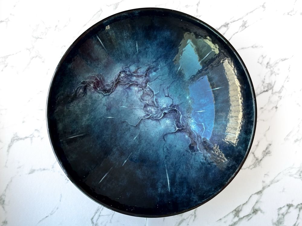 Serving bowl featuring an abstract galaxy based on the Milky Way with meteors raining down on all sides as if they are directly above the viewer. 
