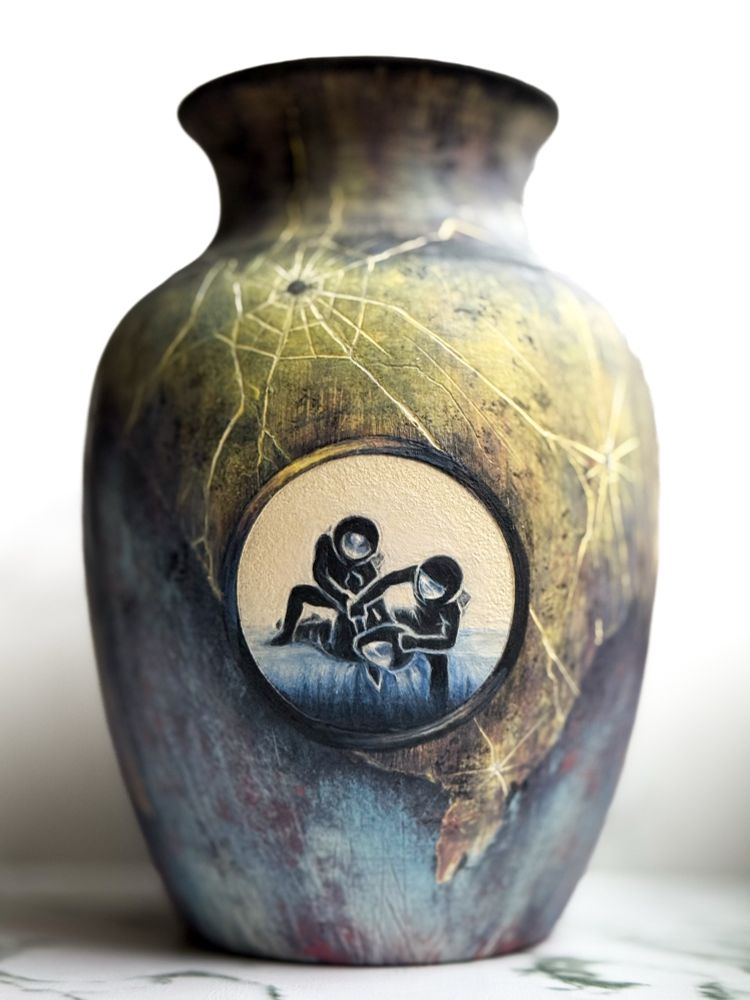 Vase featuring a weathered spacecraft design with large round window showing two astronauts holding down another with blade to his throat in a pose similar to the figures in Artemisia Gentileschi's "Judith Beheading Holofernes". The spacecraft design has paint eroding from the bottom and large impacts at the top. 