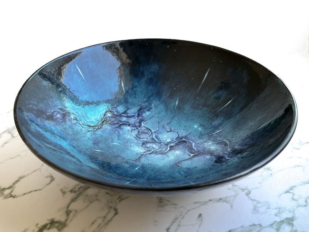 Serving bowl featuring an abstract galaxy based on the Milky Way with meteors raining down on all sides as if they are directly above the viewer. (Side)