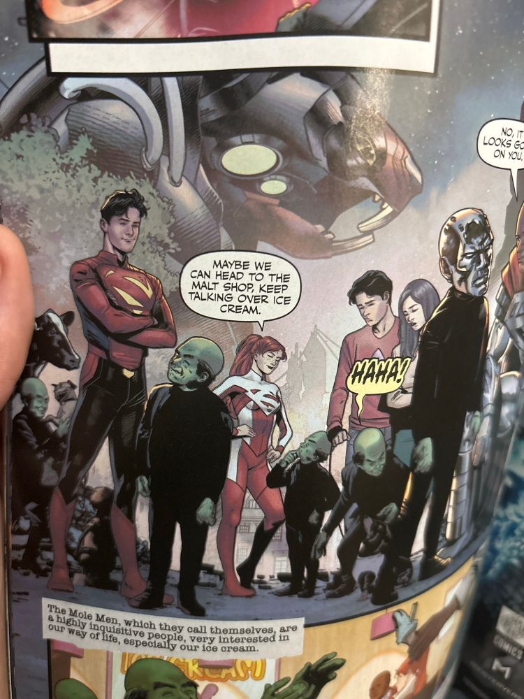 Panel from Superman Unlimited #7 showing Superman (Jon) Superwoman (Lana) along with a handful of Mole Men from Superman and the Mole Men (1951)