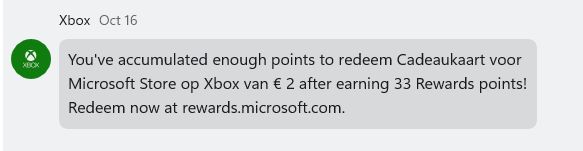 xbox chat message saying "you've accumulated enough points to redeem [in dutch: 2 euro gift card for microsoft store on xbox] after earning 33 rewards points"