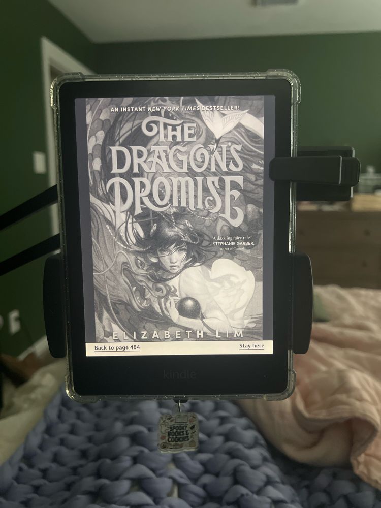 Picture of the cover of THE DRAGON'S PROMISE by Elizabeth Lim on a black Kindle.