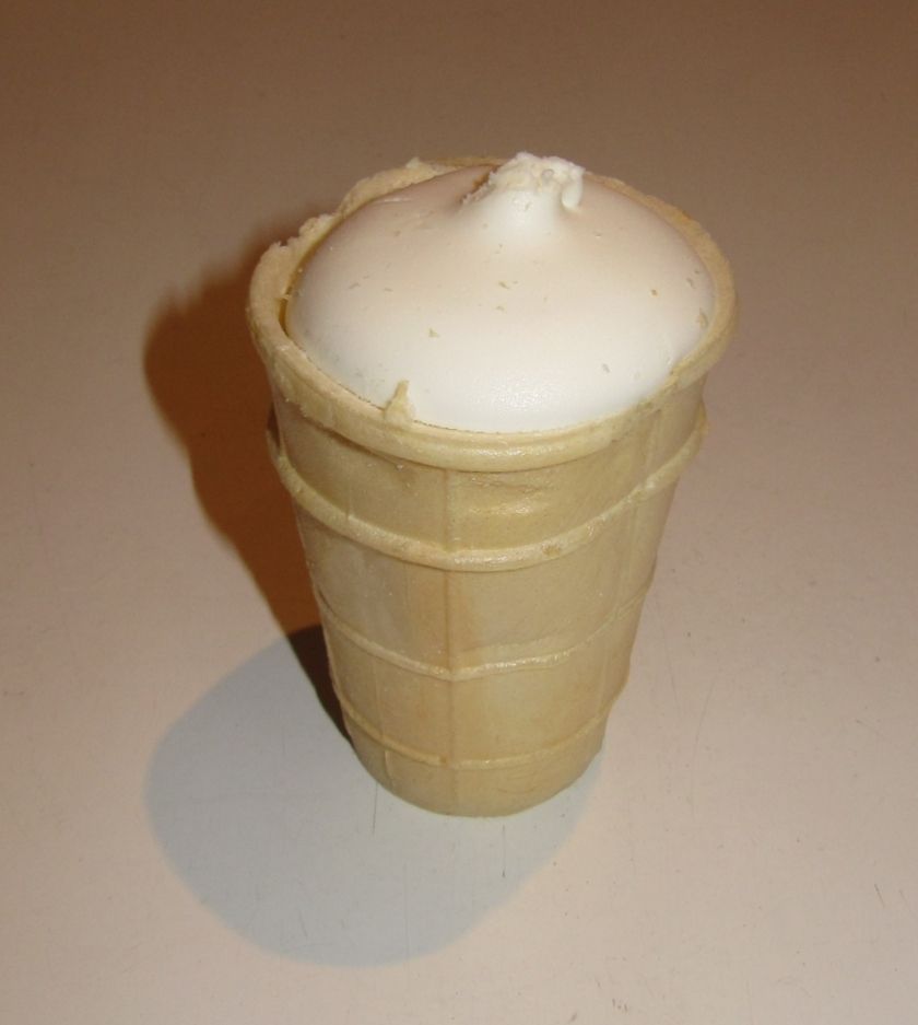 Soviet-style plombir ice cream in a waffle cup with a creamy dome top.