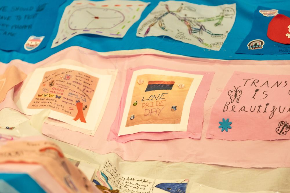 Close up of the Trans Aware Cancer Care flag. A community created trans flag, a collection of beautifully and carefully crafted squares. 