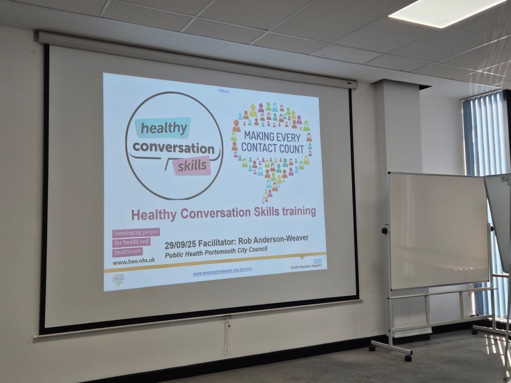 
A projector with a white background. Different colour text on the slide reads: 

Healthy conversation skills

MAKING EVERY CONTACT COUNT

Healthy Conversation Skills training

Developing people for health and Healthcares


29/09/25 Facilitator: Rob Anderson-Weaver Public Health Portsmouth City Council