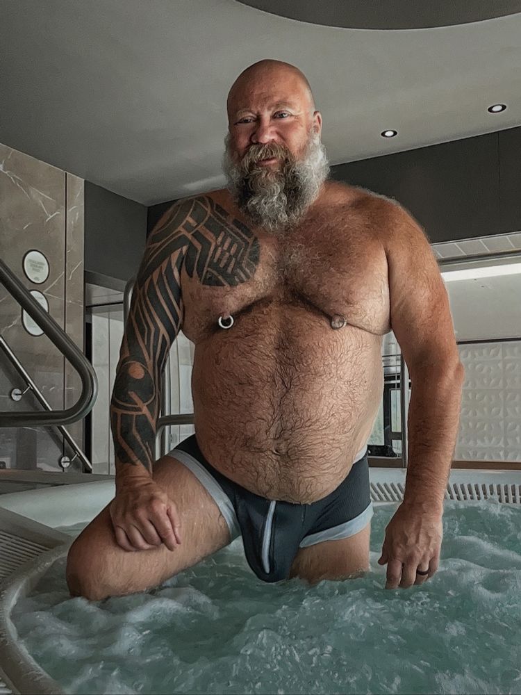 Dad in his swimsuit in the jacuzzi showing bulge 