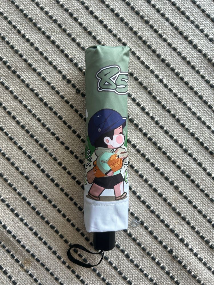 An umbrella with animated version of Yibo from Exploring the Unknown 