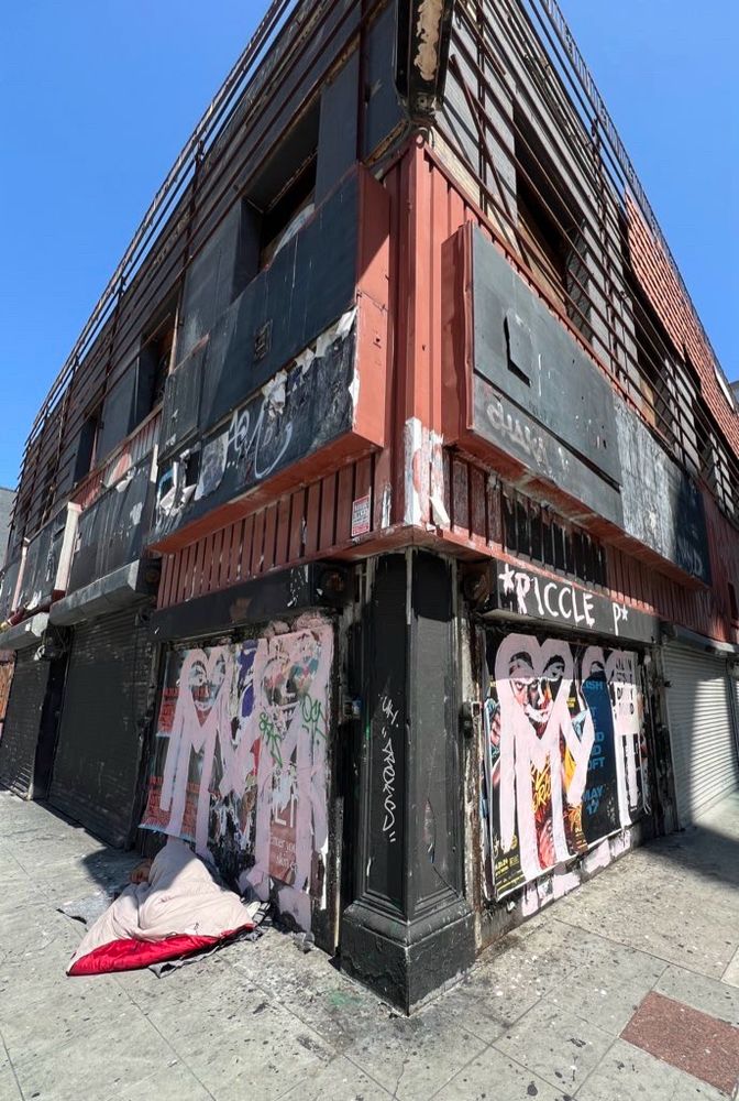 Man sleeping, Downtown LA corner, toy district
