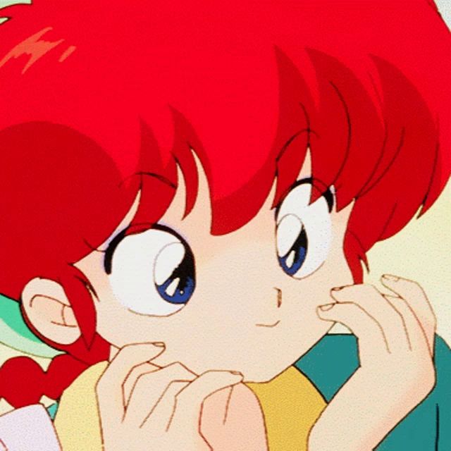 a cartoon girl with red hair and blue eyes looks at the camera