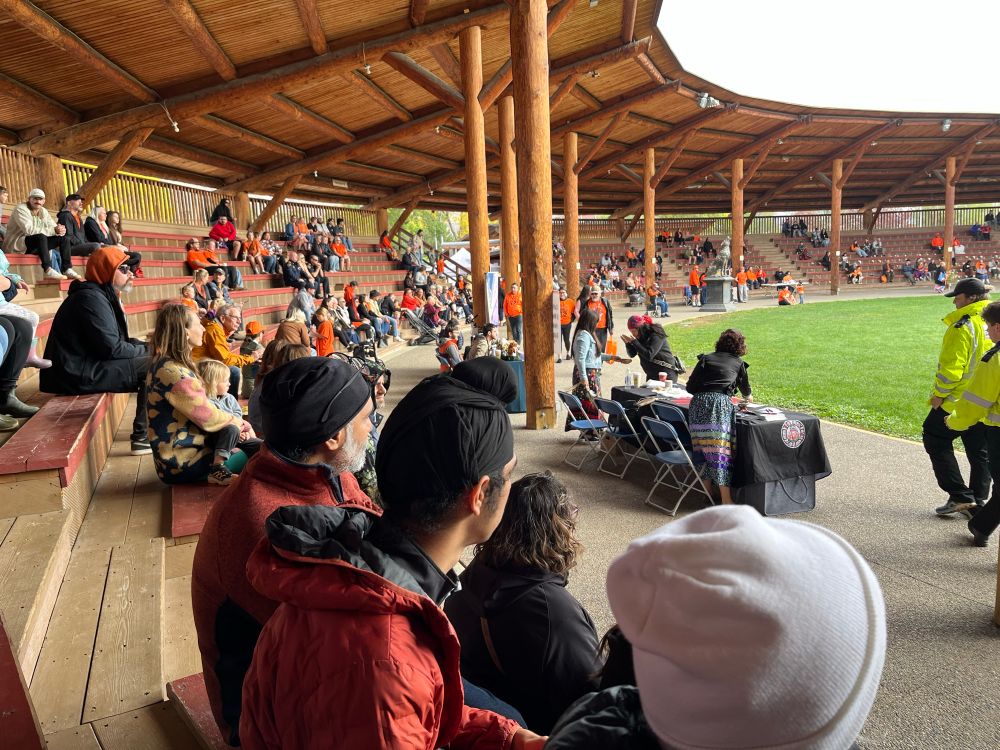 Some of the people in the stands watching the dancers and drummers. 