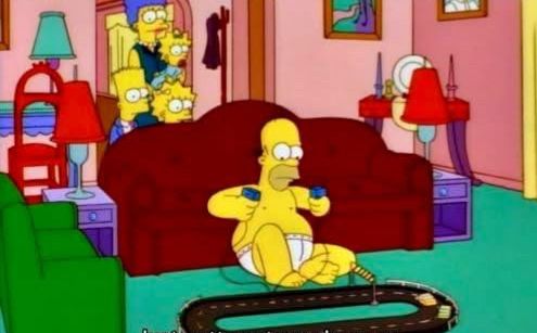 homer simpson playing with slot cars