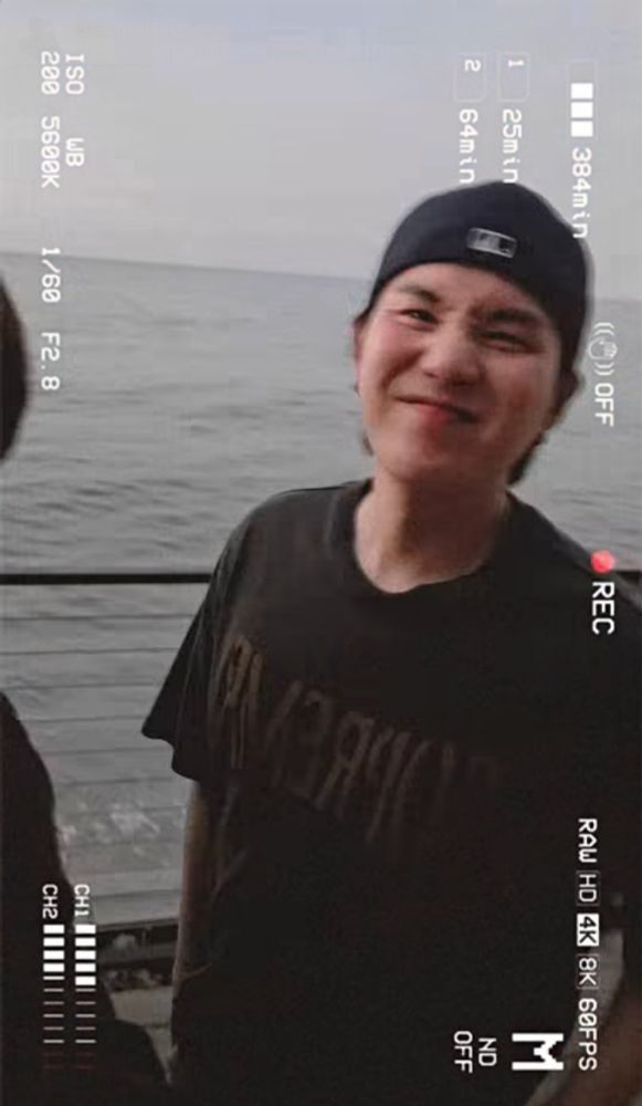 Yoongi by the sea scrunching his nose cutely at the camera