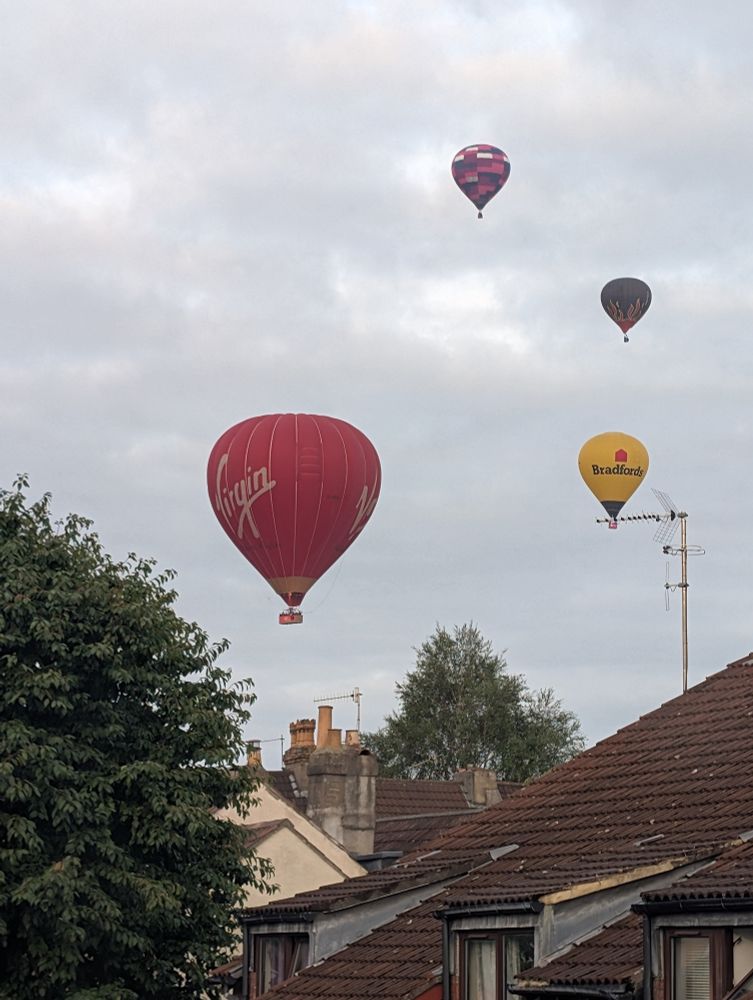 A variety of hot air balloons in the sky above Bristol