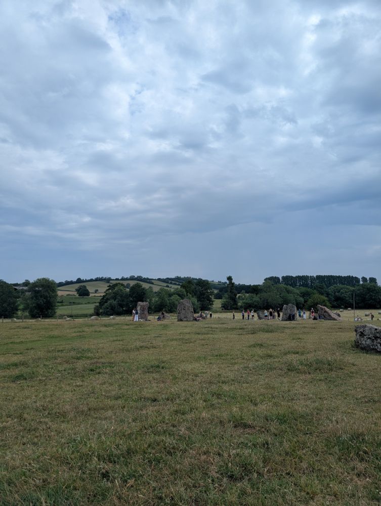 People doing yoga in Standing stones at Stanton Drew 