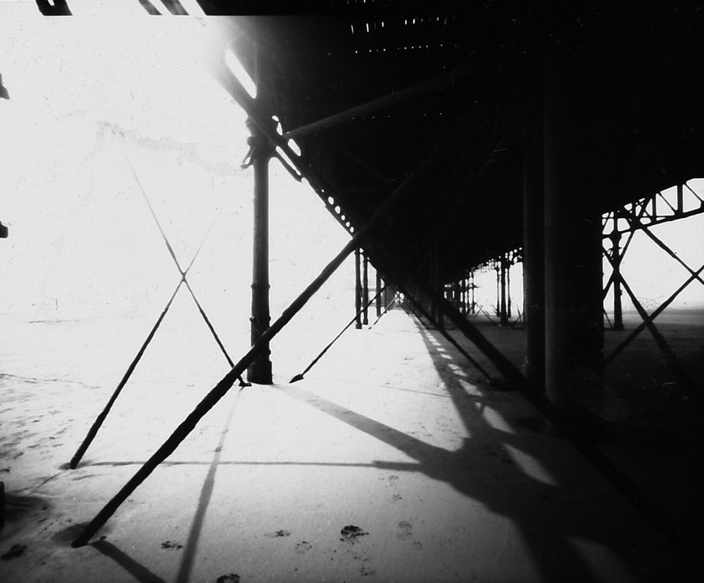 Black and white pinhole photograph underneath Weston Super Mare pier