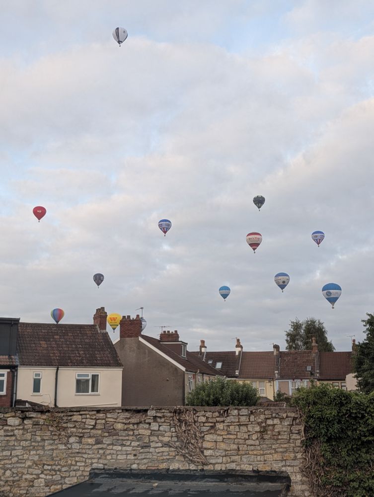 A variety of hot air balloons in the sky above Bristol