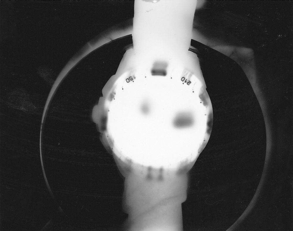 Black and white photogram of the outline of a wristwatch