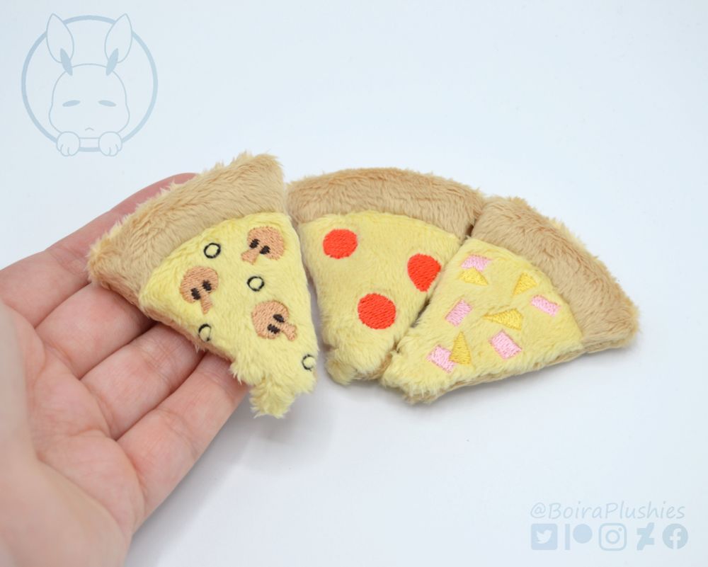 Handmade pizza slice plushies, each slice has a different flavor: mushroom and olives, pepperoni and Hawaiian