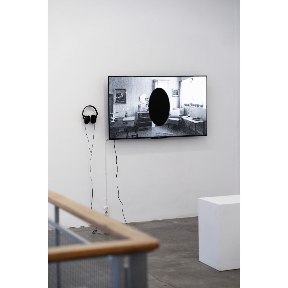 Art exhibition installation view with a TV screen and video Art piece