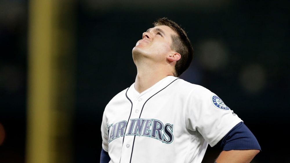 Ryon Healy grimacing at the heavens after being diagnosed with spinal stenosis. He was prescribed an epidural to ease the pain, which is what half-marathon training, and running generally, can sometimes feel like.