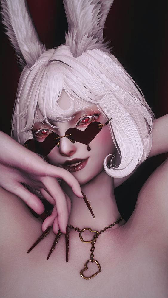 Kaj Snjor, an albinistic male viera, is captured in a portrait up close. He has short white hair curled into a bob, he is wearing heart shaped sunglasses tilted down, a gold necklace with heart shapes interlocked, and very long, coffin shaped fingernails. His lips are curled up into a smile and he gazes past the viewer through white eyelashes. 