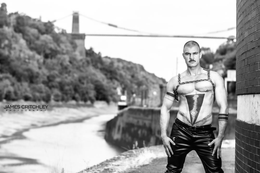 Gorgeous model Tauren posing in leather pants by the Clifton Suspension Bridge in Bristol, England.