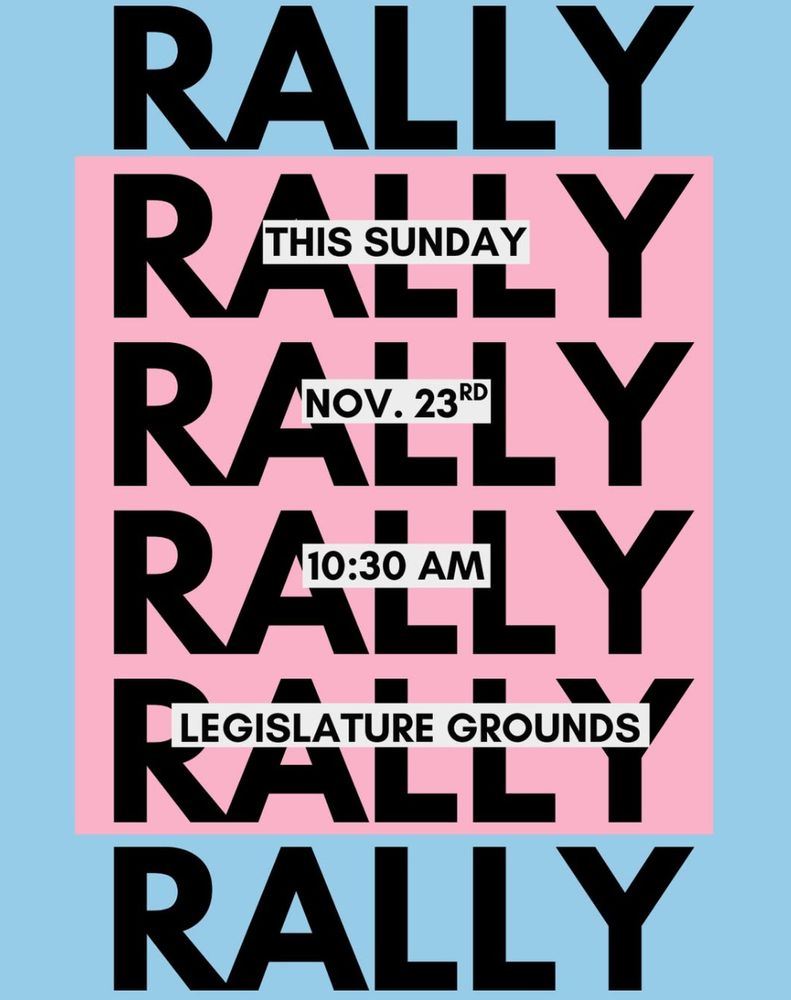 Black text on light blue and pink background. The word "Rally" is repeated several times. In the foreground, black text reads "This Sunday, Nov. 23rd, 10:30 AM, legislature grounds"