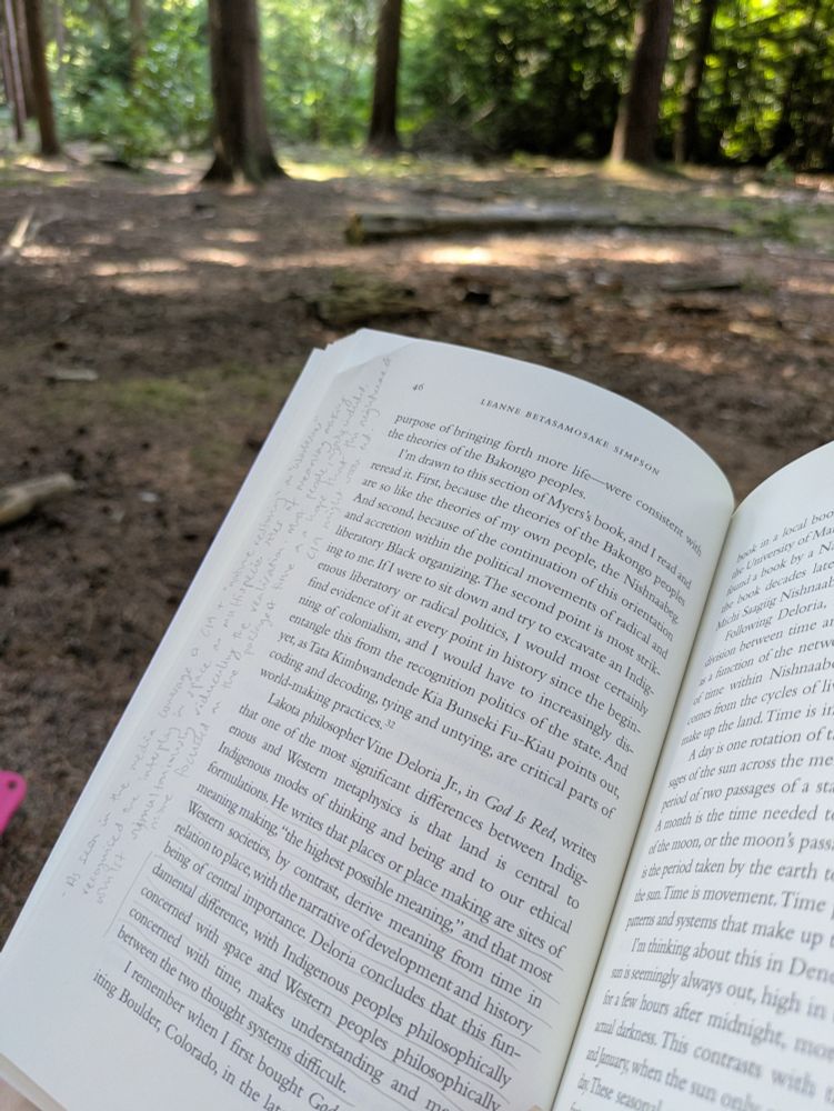 A book open with pencilled annotations 