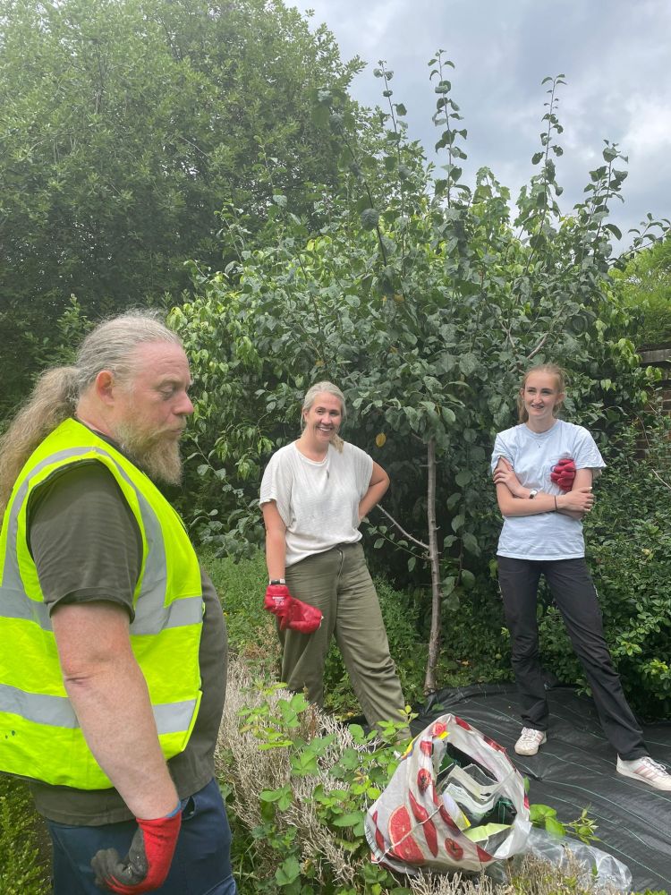 Peter giving instructions to a group of volunteers 