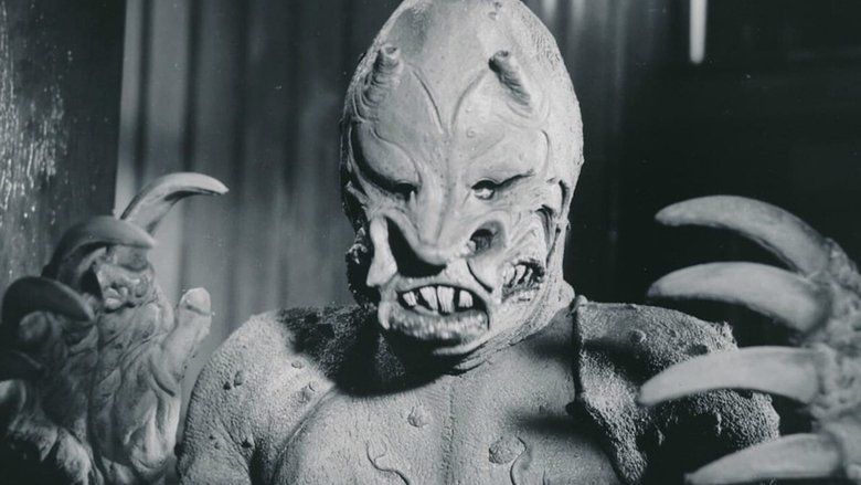 A monster with huge claws, scaly skin, pushed in nostrils, little tubes on its forehead, and piggy eyes
