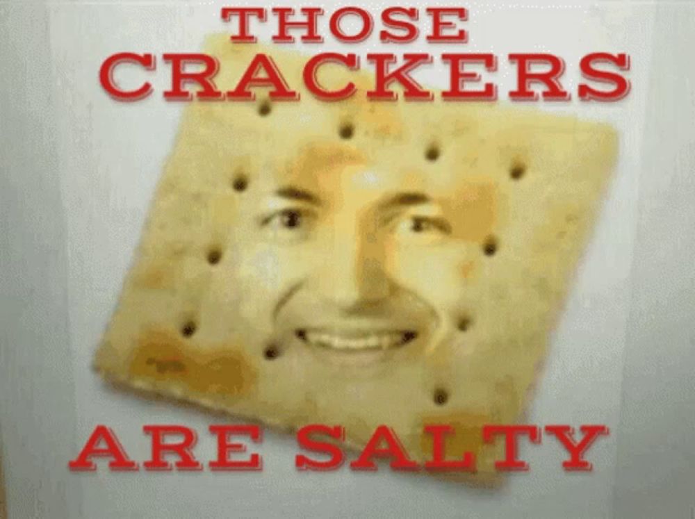 a cracker with a man 's face on it and the words " those crackers are salty " above it