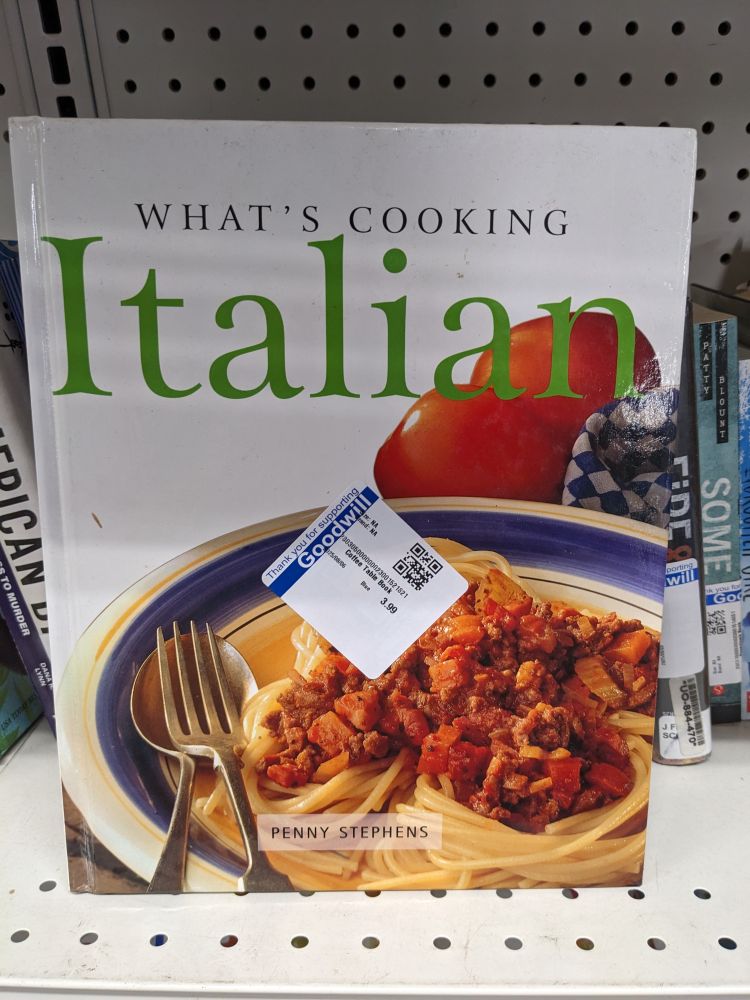 A cook book titled "Whats Cooking: Italian". The cover features a bowl of spaghetti