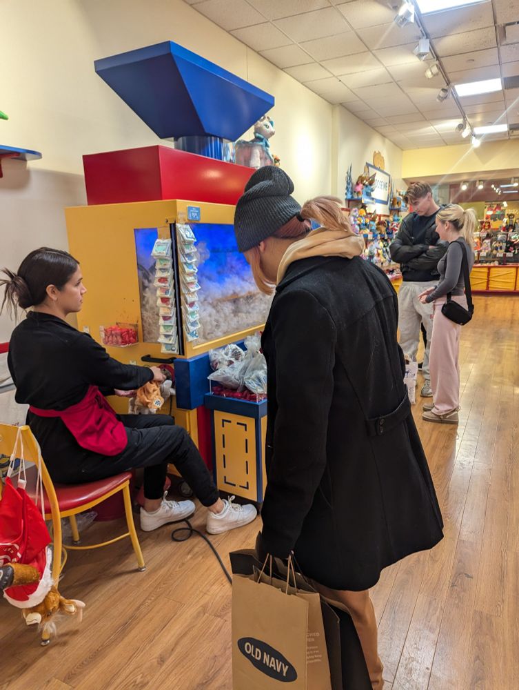 Boy waits patiently for a Cubone plushie to be filled with life. 