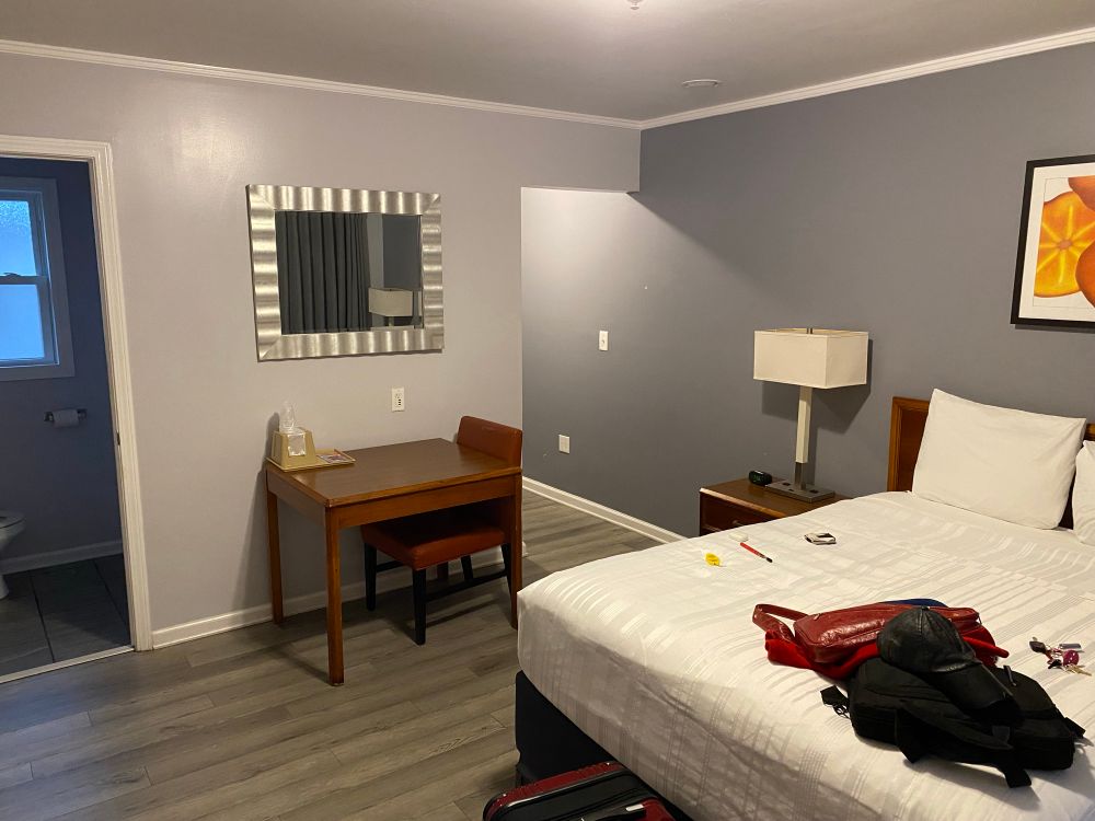 A room with a bed and table