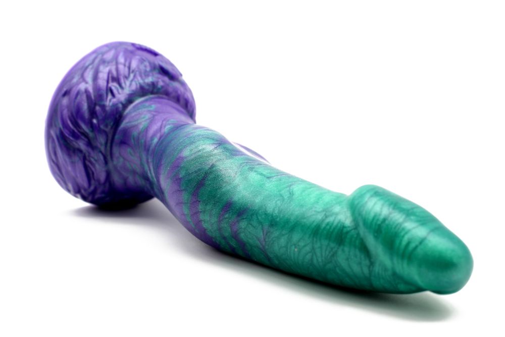 The Lunaris Werewolf dildo pictured from another angle, showing off the raised, tapered tip of the head.